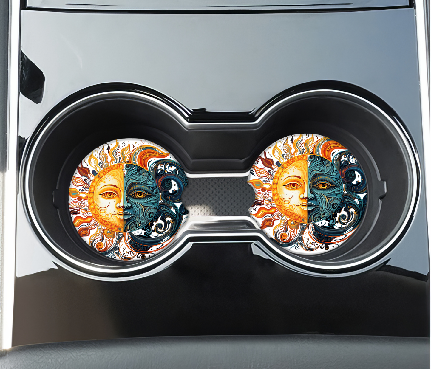 Car cup holder with decorative coasters featuring sun and moon design.