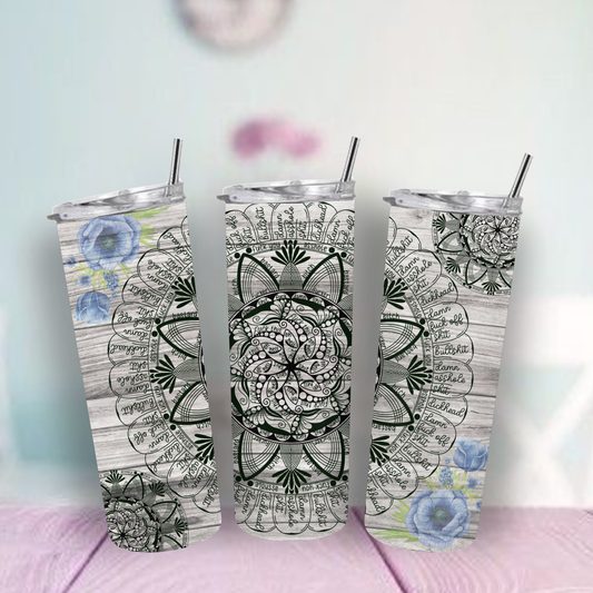tumbler with floral and mandala designs on a light background