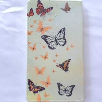 Wallet with butterfly design on a cream background
